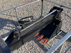 Unused skid steer fixed arm backhoe w/ 14" bucket