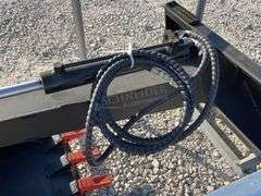 Unused skid steer fixed arm backhoe w/ 14" bucket