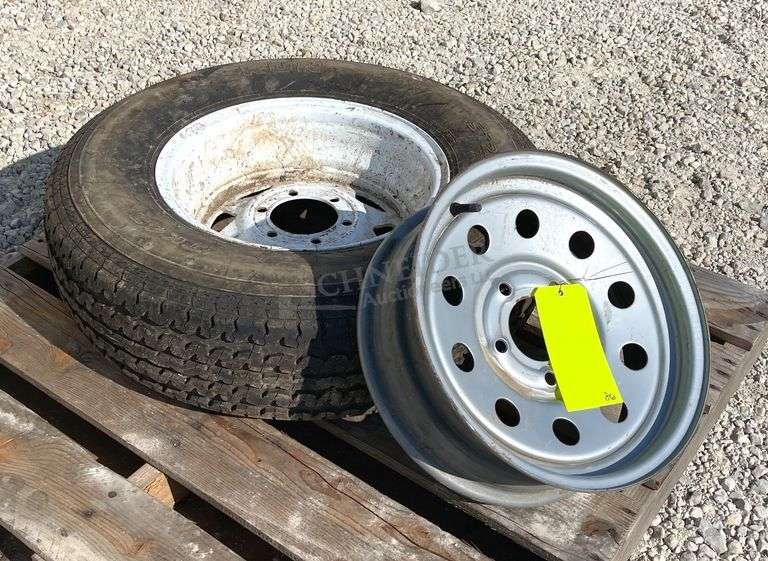 2- trailer rims, 1 has tire