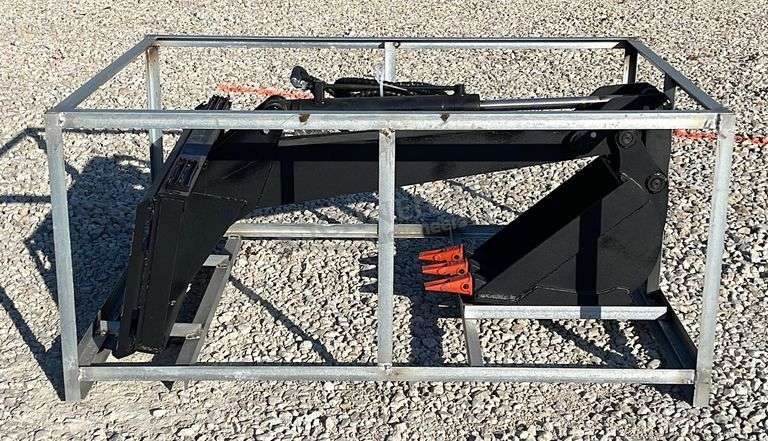 Unused skid steer fixed arm backhoe w/ 14" bucket