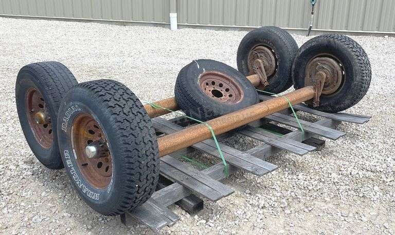 2- 6 lug rubber torsion axles w/ wheels & tires