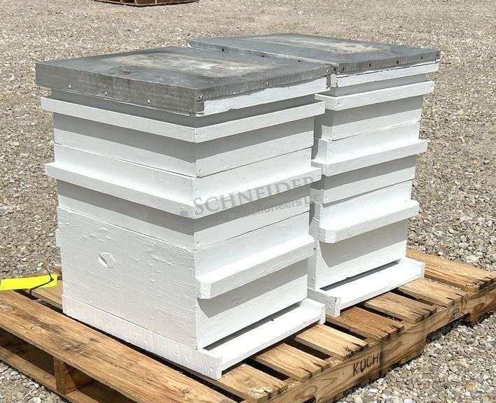 2 wooden bee hives
