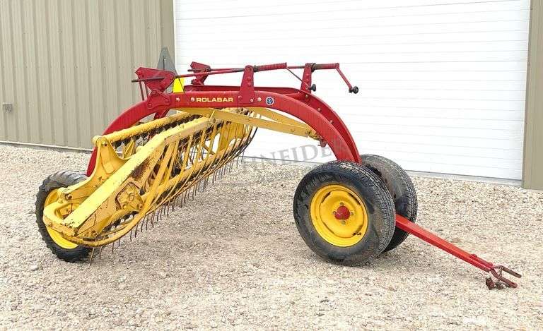 New Holland 258 side delivery hay rake w/ dolly wheels