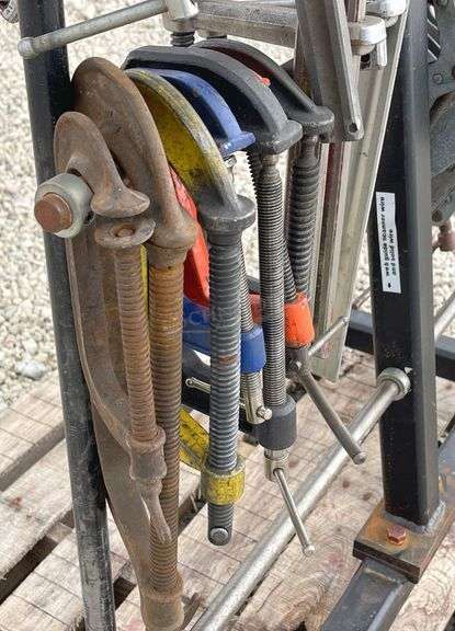 Group of clamps w/ rolling storage rack