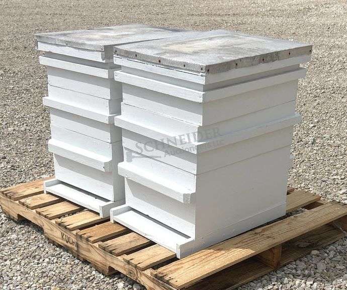 2 wooden bee hives