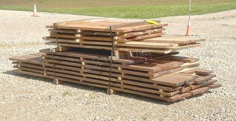 Group of walnut, cherry & oak rough cut lumber