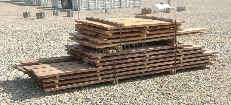 Group of walnut, cherry & oak rough cut lumber