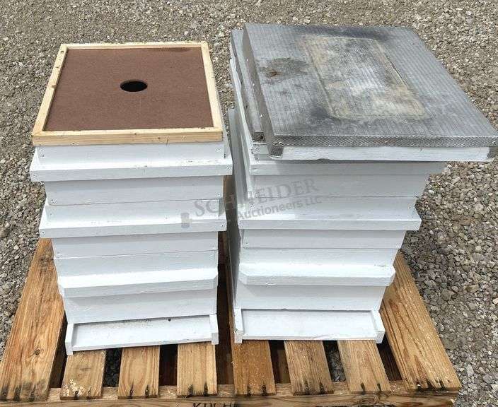 2 wooden bee hives