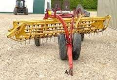 New Holland 258 side delivery hay rake w/ dolly wheels