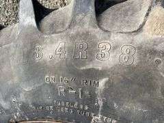 Pair of Firestone 18.4-38 tractor tires on rims w/ hubs