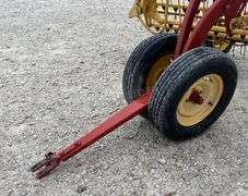 New Holland 258 side delivery hay rake w/ dolly wheels