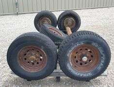 2- 6 lug rubber torsion axles w/ wheels & tires