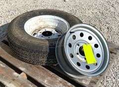 2- trailer rims, 1 has tire