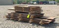 Group of walnut, cherry & oak rough cut lumber