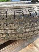 2- trailer rims, 1 has tire