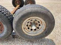 2- 6 lug rubber torsion axles w/ wheels & tires