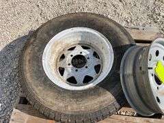 2- trailer rims, 1 has tire
