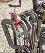 Group of clamps w/ rolling storage rack