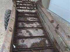 Ground drive manure spreader w/ steel floor