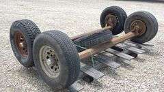 2- 6 lug rubber torsion axles w/ wheels & tires