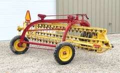 New Holland 258 side delivery hay rake w/ dolly wheels