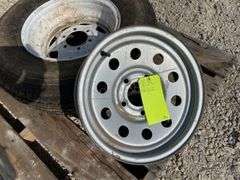 2- trailer rims, 1 has tire
