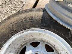 2- trailer rims, 1 has tire