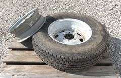 2- trailer rims, 1 has tire