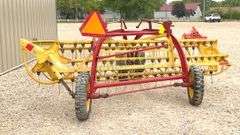 New Holland 258 side delivery hay rake w/ dolly wheels