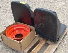 2-unused equipment seats & a Kubota rim