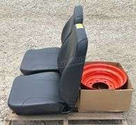 2-unused equipment seats & a Kubota rim