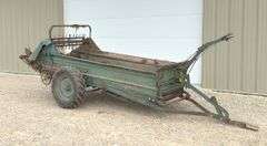 Ground drive manure spreader w/ steel floor