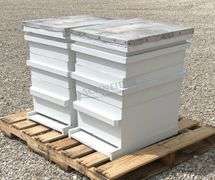 2 wooden bee hives