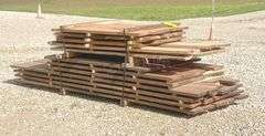 Group of walnut, cherry & oak rough cut lumber