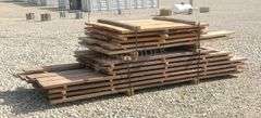 Group of walnut, cherry & oak rough cut lumber
