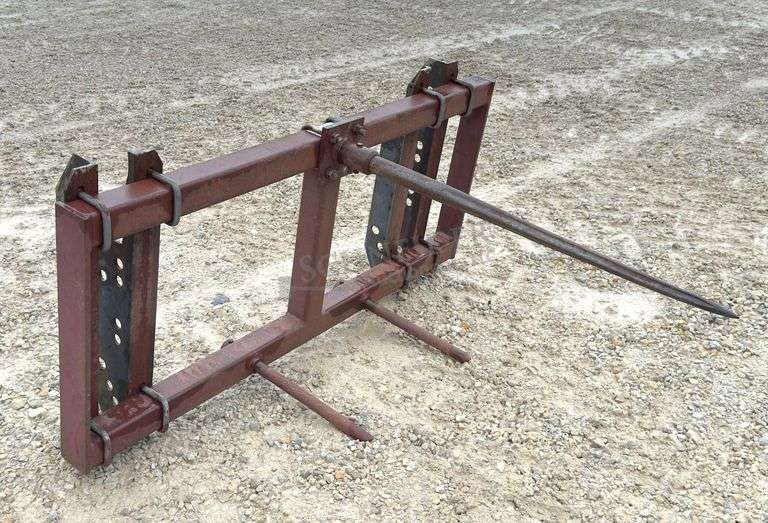 Pin on bale spear for loader w/ adjustable brackets