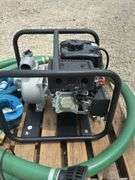 Unused Red Lion 2" gas water pump w/ hoses