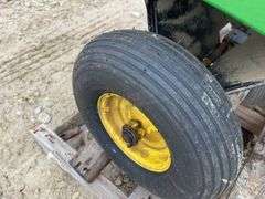John Deere 10S dump lawn cart