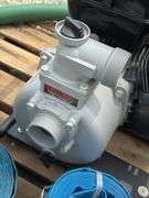 Unused Red Lion 2" gas water pump w/ hoses