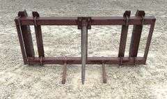 Pin on bale spear for loader w/ adjustable brackets