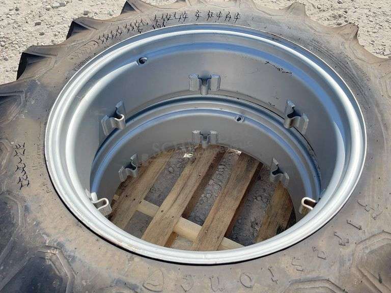 Pair of unused 12.4-28 tractor tires on unused rims