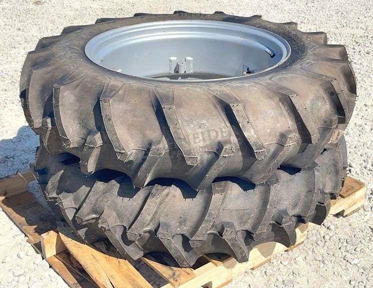 Pair of unused 12.4-28 tractor tires on unused rims