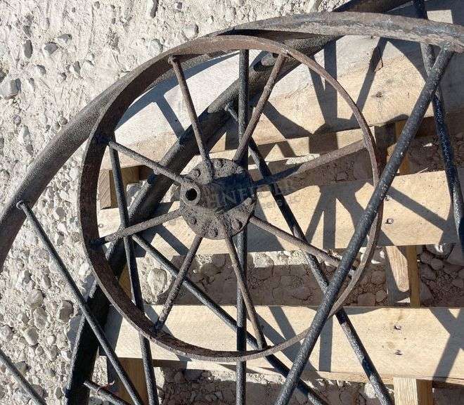 2- 55" antique iron implement wheels