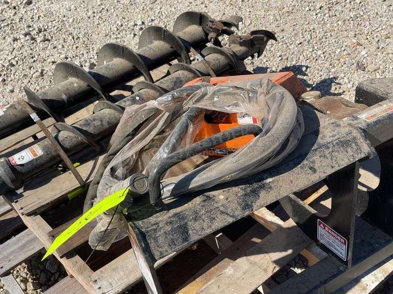 Unused Skid Pro skid steer auger w/ 2 augers, from the estate of Dr. Ken Buchmann