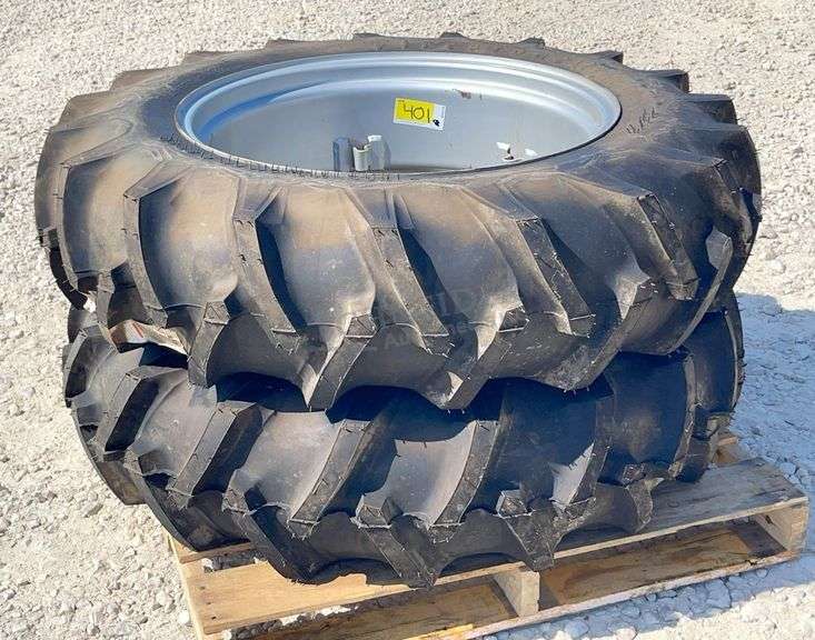 Pair of unused 12.4-28 tractor tires on unused rims