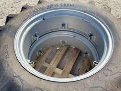 Pair of unused 12.4-28 tractor tires on unused rims