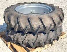 Pair of unused 12.4-28 tractor tires on unused rims