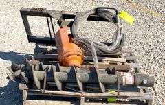 Unused Skid Pro skid steer auger w/ 2 augers, from the estate of Dr. Ken Buchmann