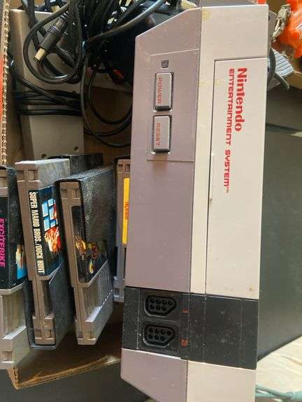 Nintendo with games, controllers and gun, Super Mario, Duckhunt etc.