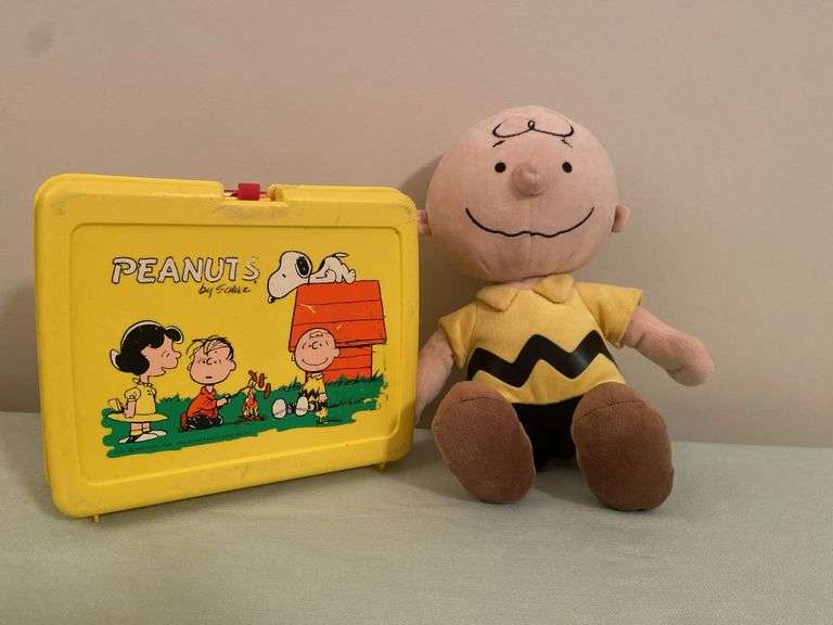 Peanuts lunchbox and Charlie Brown plush